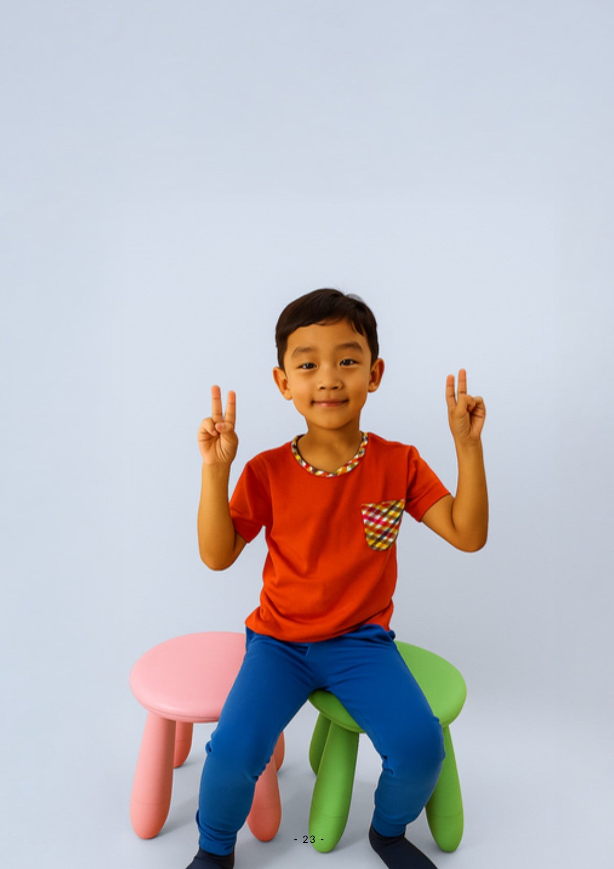 Boy wearing Ola! Otter organic cotton joggers and a pocket tee