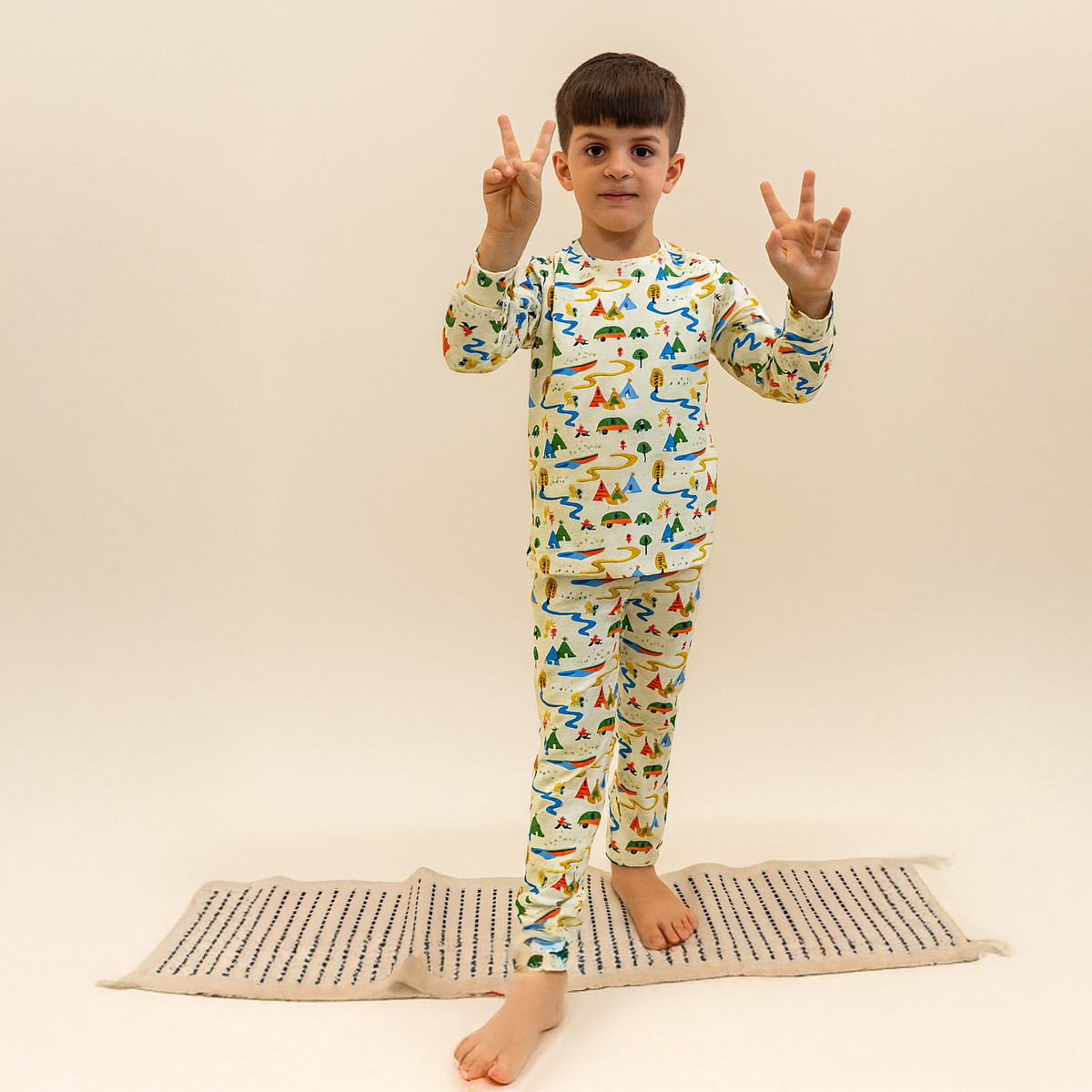 Babies and toddlers in Ola! Otter organic cotton rompers and nightsuits