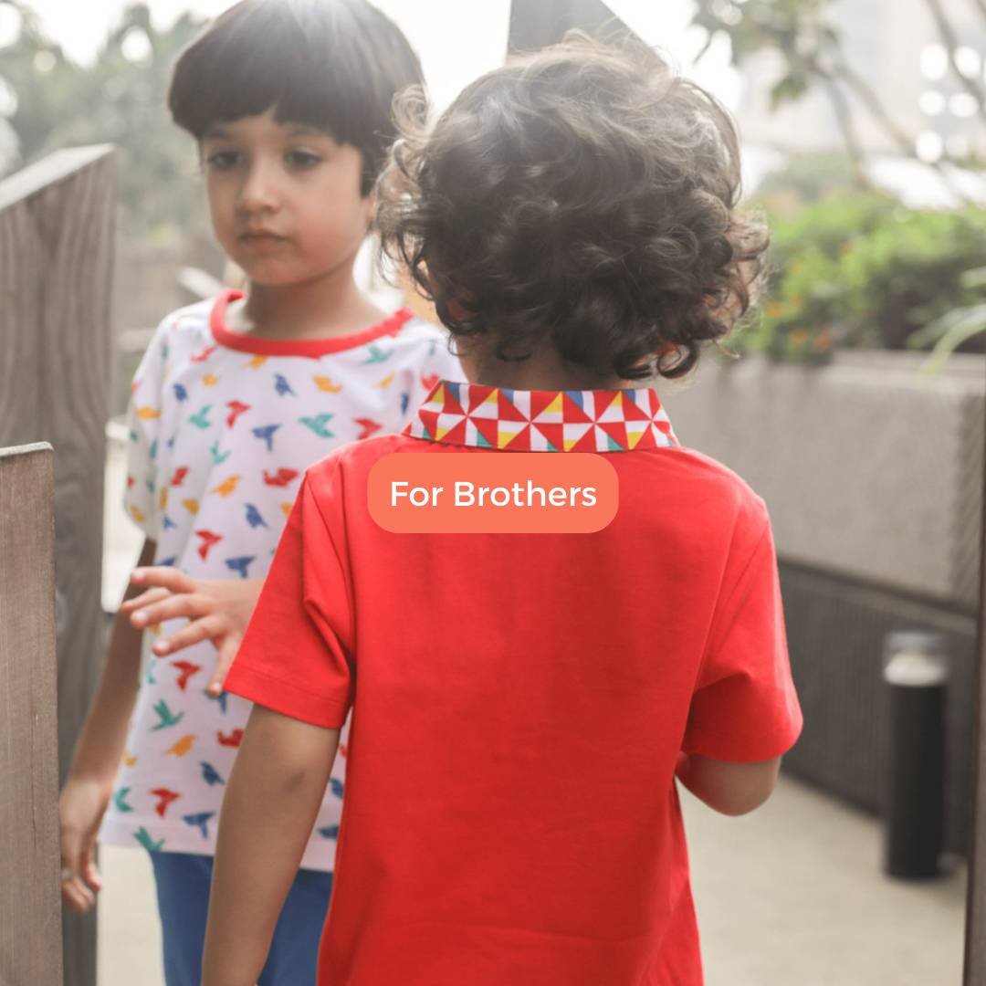 An image displaying a set of matching organic cotton t-shirts and pants designed for boys. These twin outfits come in a variety of playful colors and patterns, making them ideal and eco-friendly gifts for young brothers